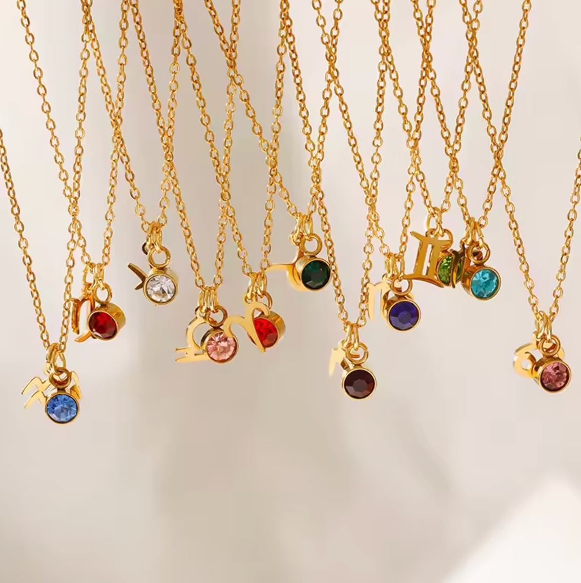 Astrological Birthstone Pendants. Crafted from stainless steel and available in luxurious 14K gold, sleek silver, or rose gold plating, this necklace features your zodiac sign alongside your birthstone.