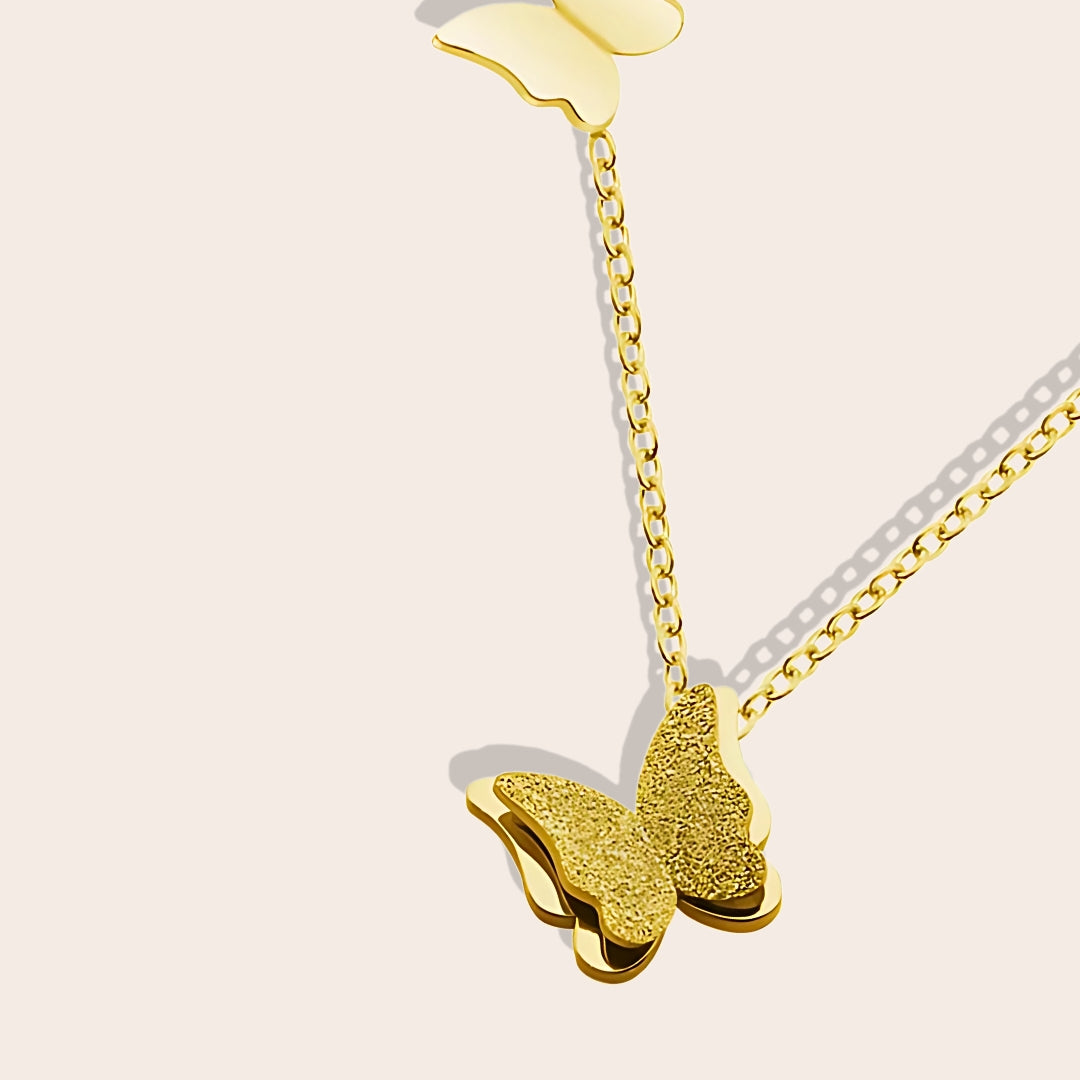 Close up of Belle Butterfly Necklace in gold. Crafted from durable stainless steel.