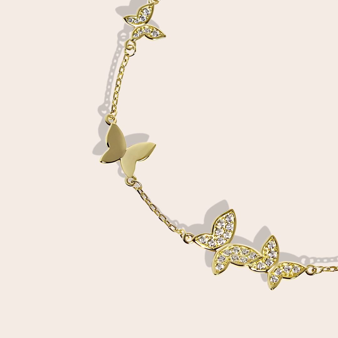 Close up of Beret Butterfly Bracelet, a charming piece crafted from sterling silver and adorned with sparkling crystals.