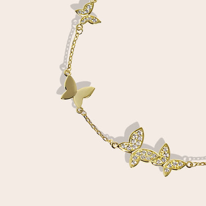 Close up of Beret Butterfly Bracelet, a charming piece crafted from sterling silver and adorned with sparkling crystals.