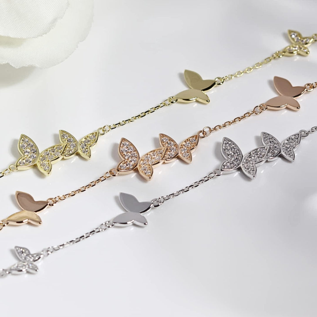 Lifestyle shot of Beret Butterfly Bracelet, a charming piece crafted from sterling silver and adorned with sparkling crystals.