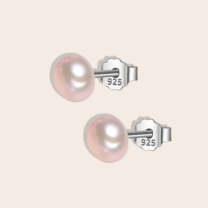 Bianca Baroque Pearl Studs in lavender. These stunning earrings feature unique freshwater pearls nestled in 925 sterling silver settings and plated with 18K gold.