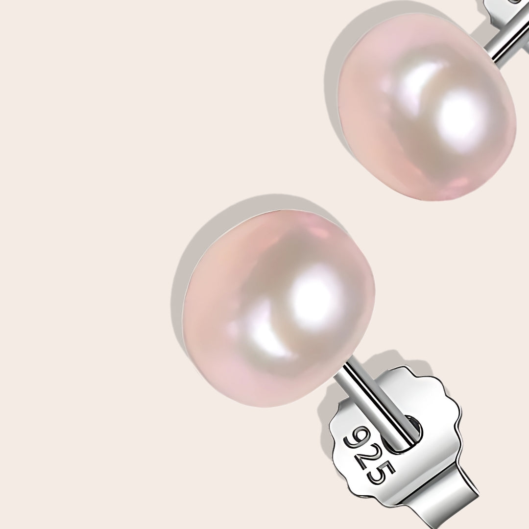 Close up of Bianca Baroque Pearl Studs in lavender. These stunning earrings feature unique freshwater pearls nestled in 925 sterling silver settings and plated with 18K gold.