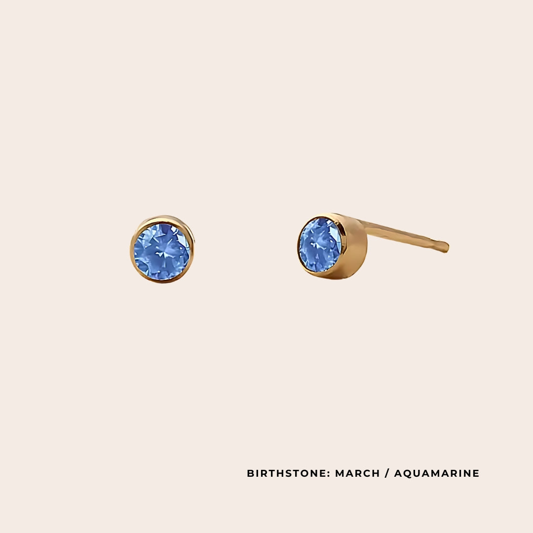 Birthstone Classic Studs March. Made from stainless steel and available in luxurious 14K gold, sleek silver, or rose gold plating, these stunning earrings feature Swarovski style crystals.