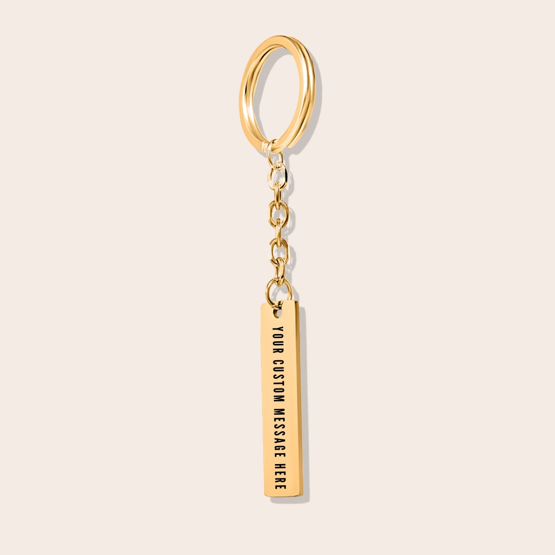 Vertical Bar Keychain - Break the Mold back side. Made from durable stainless steel and luxuriously plated in 18K gold with a positive affirmation.