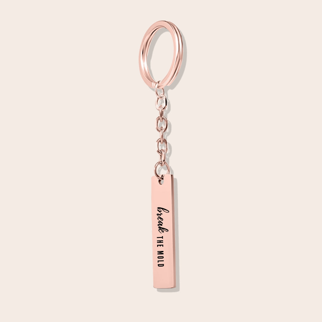 Vertical Bar Keychain - Break the Mold. Made from durable stainless steel and luxuriously plated in 18K rose gold with a positive affirmation.