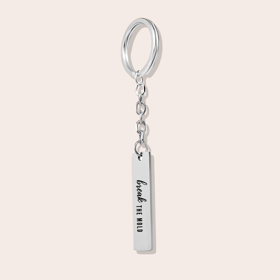 Vertical Bar Keychain - Break the Mold. Made from durable stainless steel and luxuriously plated in silver steel with a positive affirmation.