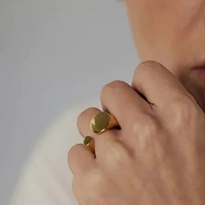 Briar Bifacial Signet Ring on model. Crafted from stainless steel and luxuriously plated in real gold.