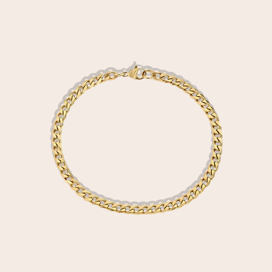 Cooper Curb Chain Bracelet is crafted from 14K gold plated stainless steel. 4mm in gold.