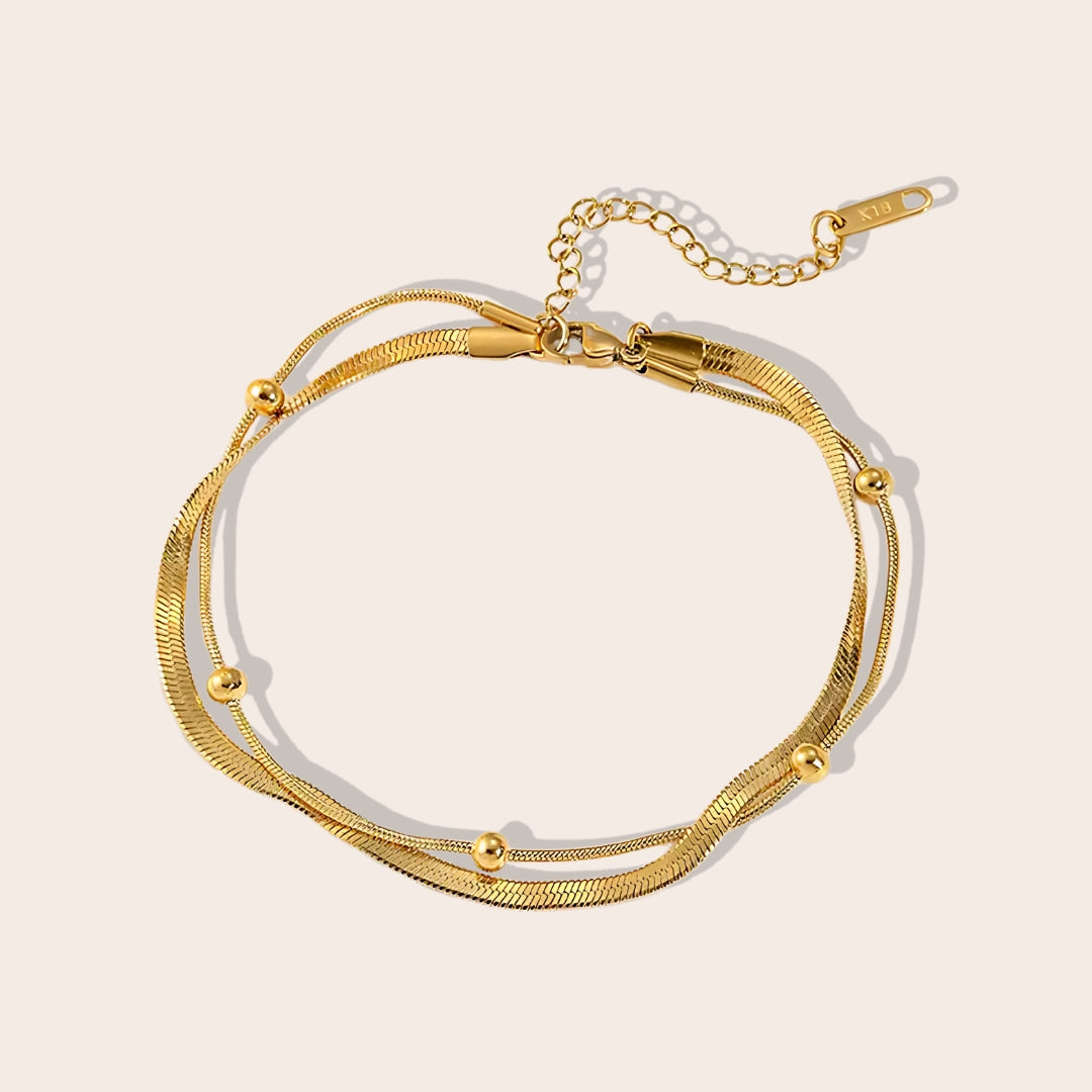 Dion Dual Chain Anklet. Constructed from stainless steel, this anklet features a delightful duo of chains.