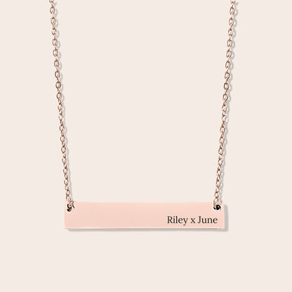 Customizable couples name necklace with front engraving and special message for back engraving. Rose gold, horizontal bar orientation.