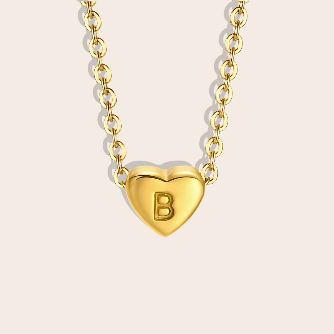 Hana Heartstrings Pendant, B. Made from stainless steel and enhanced with lustrous PVD plating.