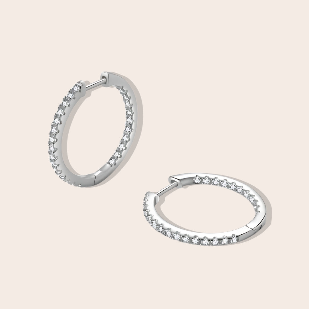 Ilia Inlaid Zircon Huggies in silver, a sterling silver, dazzling fusion of elegance and playful charm.