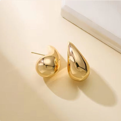 Large Tais Teardrop Earrings in gold. These eye-catching beauties, crafted from lightweight stainless steel and adorned with lustrous 18K gold plating.