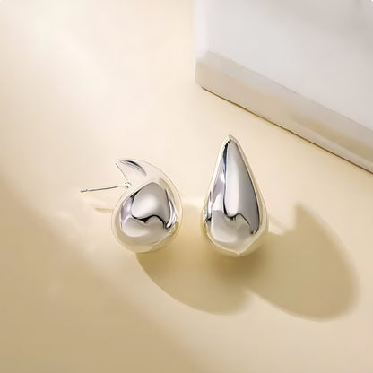 Large Tais Teardrop Earrings in silver. These eye-catching beauties, crafted from lightweight stainless steel and adorned with lustrous 18K gold plating.