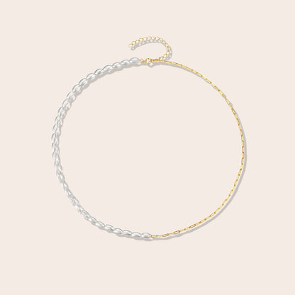 Mona Millet Pearl Choker in gold. This eye-catching piece features lustrous pearls paired with a delicate paperclip chain, all crafted from premium 925 sterling silver for lasting beauty and comfort.