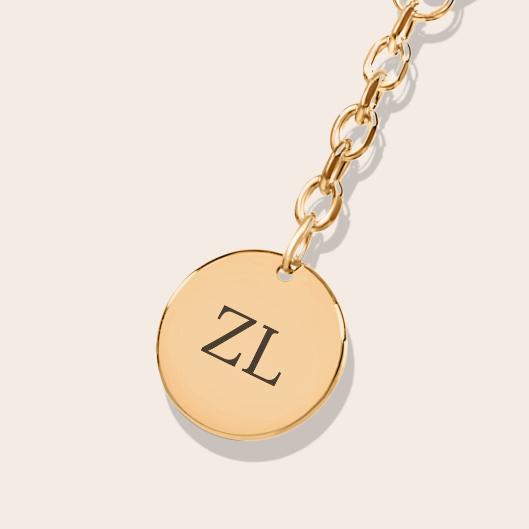 Close up of personalized Initials Coin Keychain in gold.