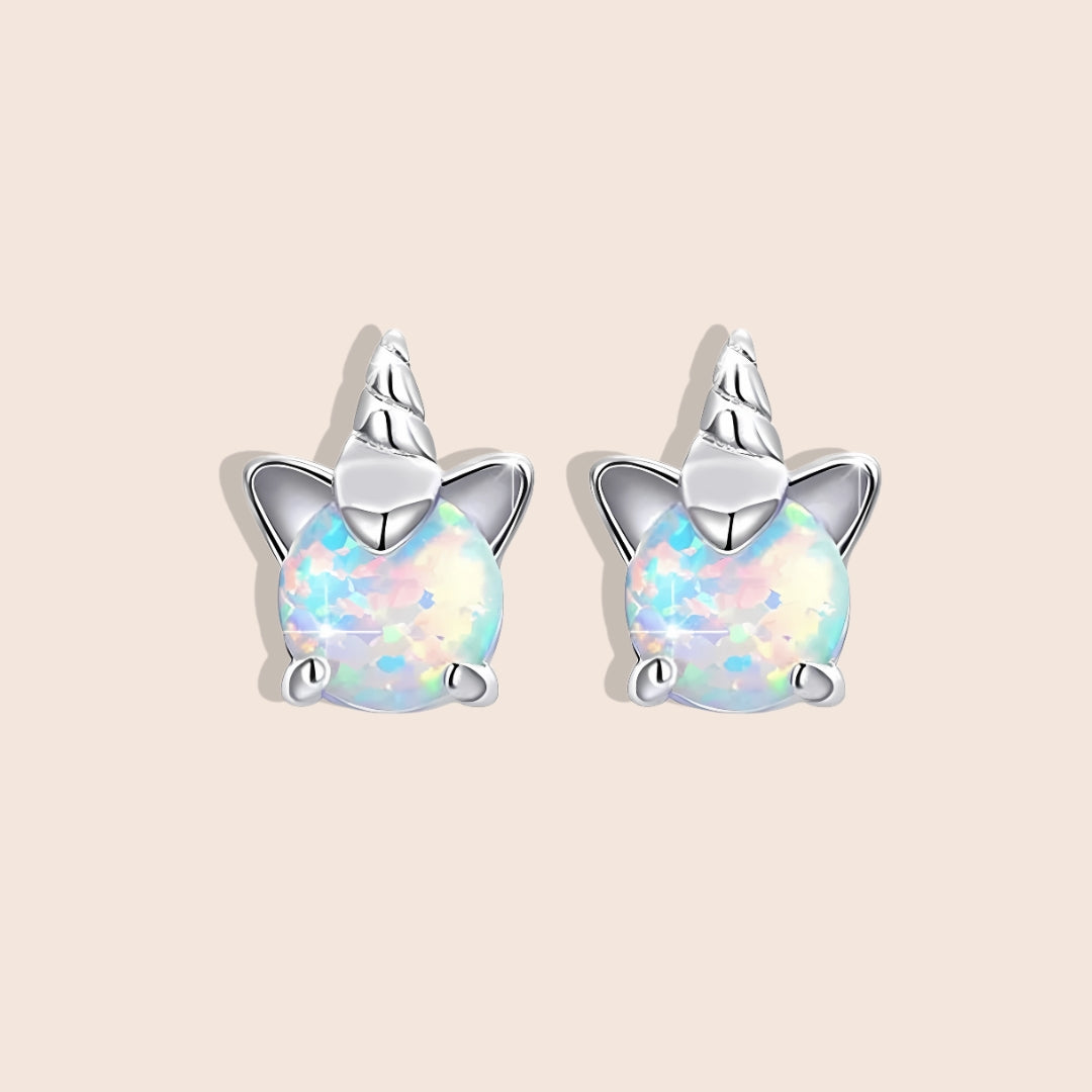 Opal Unicorn Stud Earrings. Crafted from 925 sterling silver, plated with platinum, and adorned with shimmering white opals.