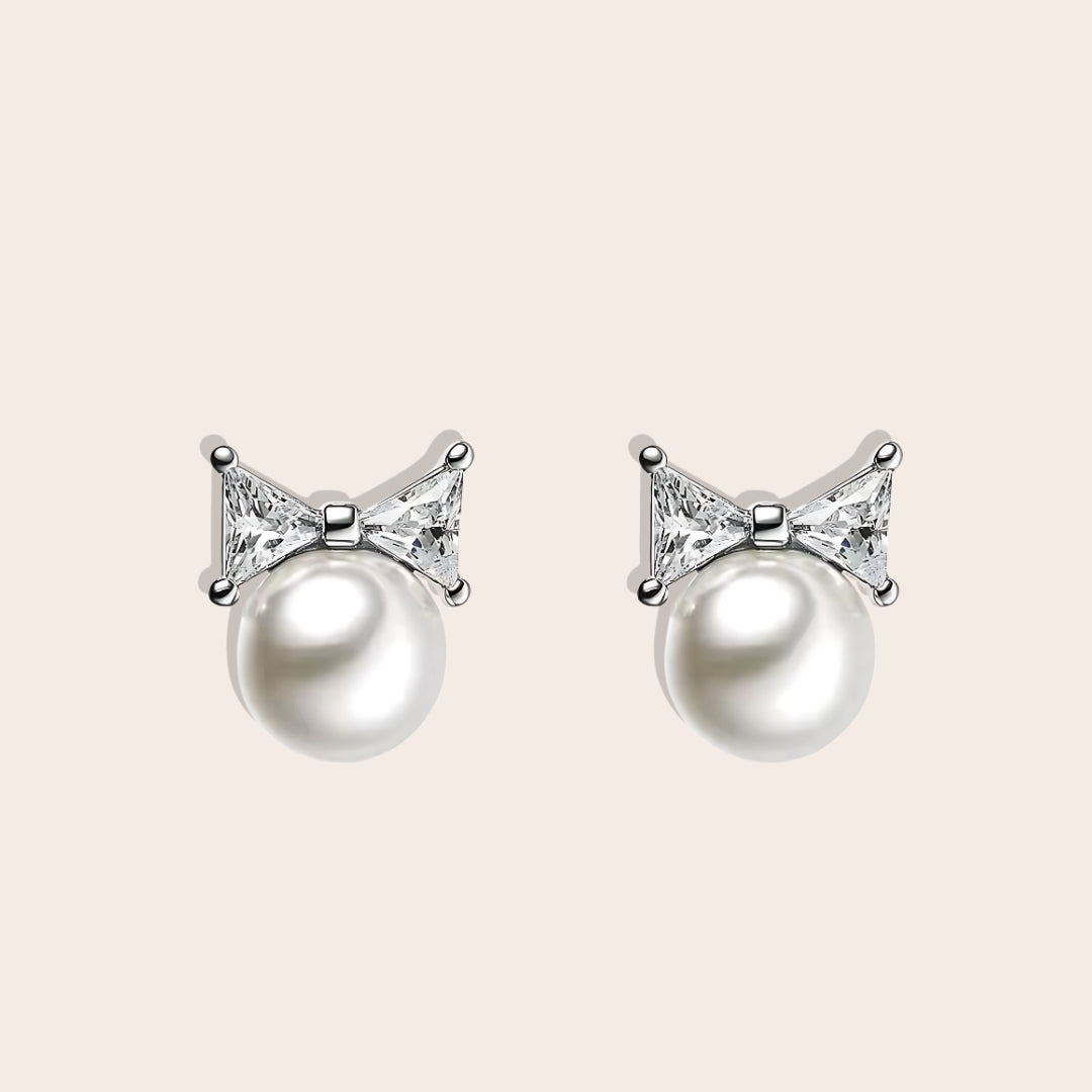 Paloma Pearl Bow Studs, crafted from 925 sterling silver and adorned with shimmering zircon stones in silver.