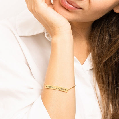 Custom Coordinates Bracelet in gold. Lobster clasp, 18K plated stainless steel on smiling model.