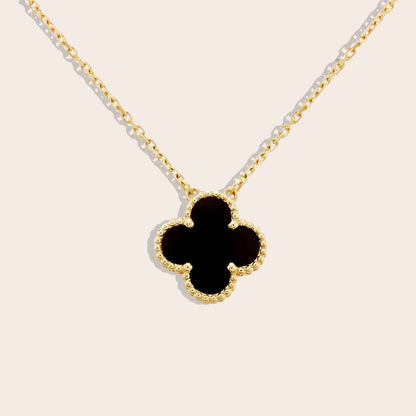 Quirine quatrefoil necklace in black. Crafted from lasting stainless steel and luxuriously gold plated.