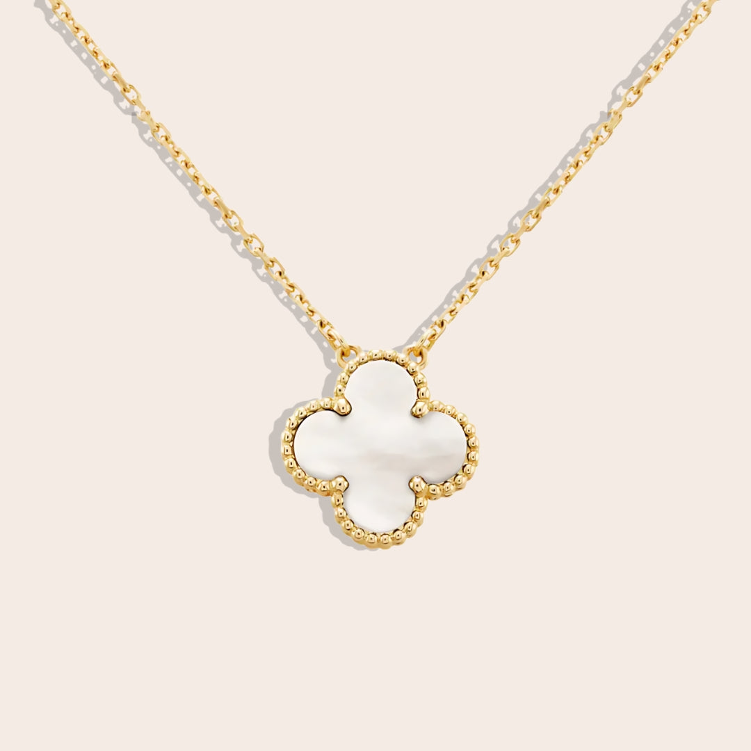 Quirine quatrefoil necklace in pearl white. Crafted from lasting stainless steel and luxuriously gold plated.