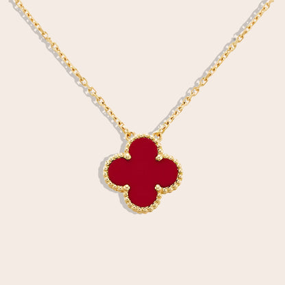 Quirine quatrefoil necklace in red. Crafted from lasting stainless steel and luxuriously gold plated.