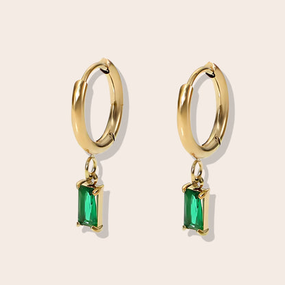 Rhea Rectangular Huggies in emerald. Made from stainless steel and plated with 18k gold, these earrings are inlaid with sparkling cubic zirconia.