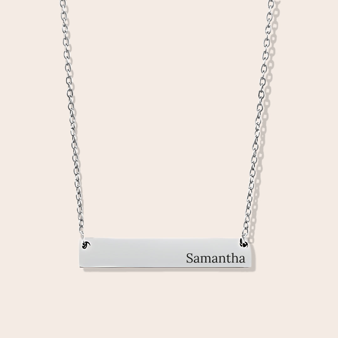 Customizable couples name necklace with front engraving and special message for back engraving. Silver, horizontal bar orientation.