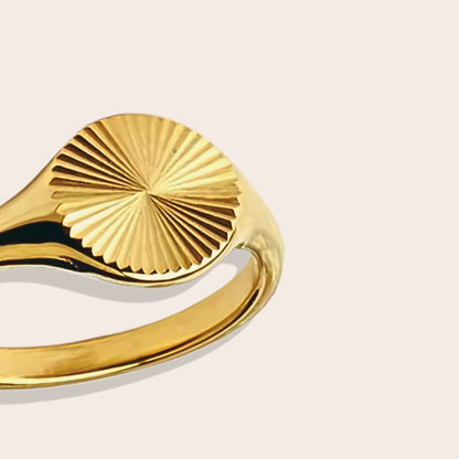 Close up of Suri Sunbeam Signet Ring, made of stainless steel in 18K plated gold.