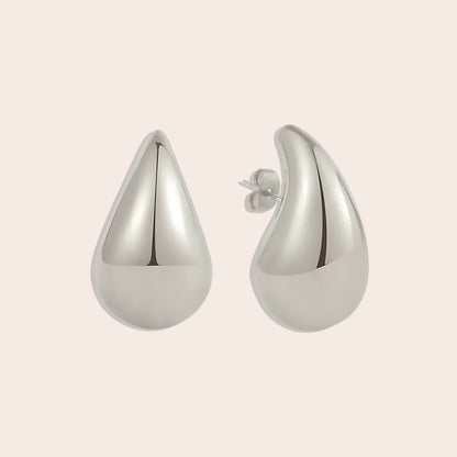 Medium Tais Teardrop Earrings in silver. These eye-catching beauties, crafted from lightweight stainless steel and adorned with lustrous 18K gold plating.