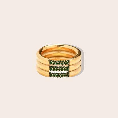 Tris Trifecta Ring, featuring a stunning combination of stainless steel and sparkling rhinestones in emerald.